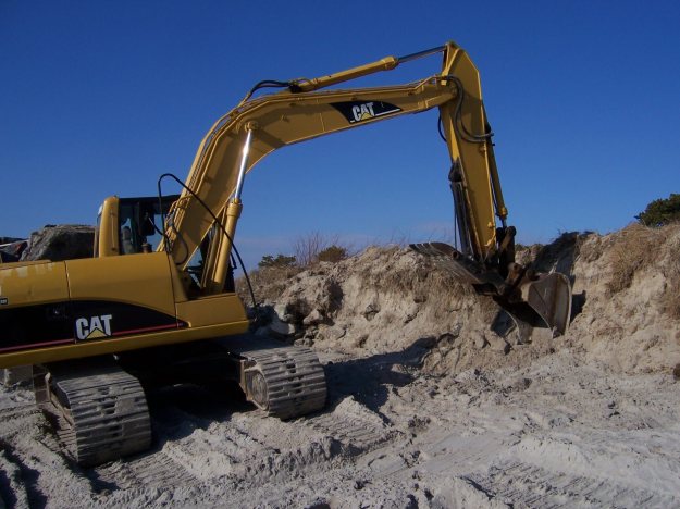 Ever-so-gently massaging the dunes on Western Beach.